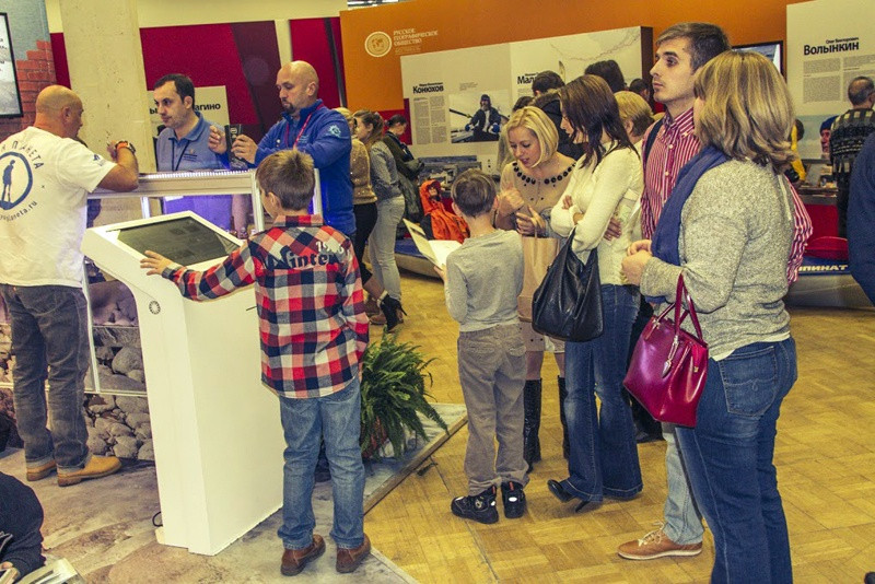 Guests learning the history and nature of the islands on the touch panel