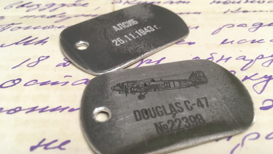 Great-Granddaughter of Hero of Alsib Presented With Commemorative Badge Made of Metal of Her Great-Grandfather's Plane